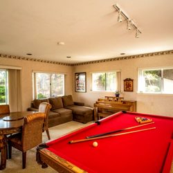 Spacious recreation room at Villa Cabrillo. Game table and game cabinet full of games for all ages.