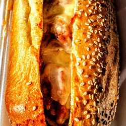 Antonella's Italian Kitchen - Meatball Parmigiana: meatballs, marinara, parmesan, mozzarella & served on a 12 inch liscios seeded roll.
