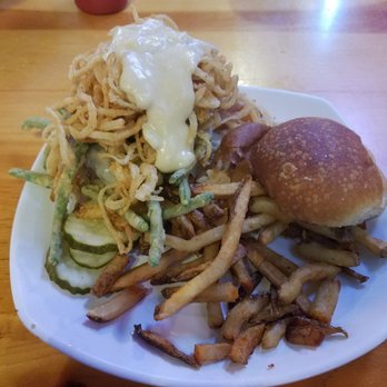 Crawfish Junction - Thanksgiving green bean casserole on a plate!  Deep fried green beans under a burger w/haystack onion rings N mushroom gravy - Bars Near Me - Johnson Creek, Wisconsin