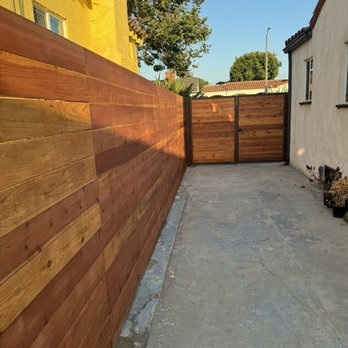 TH Gates & Fences - Red wood fence and iron framed gate installed around 1920s built Spanish style home - Fences & Gates Near Me - Los Angeles, California TH Gates & Fences - Red wood fence and iron framed gate installed around 1920s built Spanish style home - Fences & Gates Near Me - Los Angeles, California