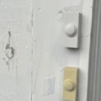 Paint For Less - Painting doorbell which is now stuck  and doesn't work but if enlarged will show very thin paint with old paint bleeding through - Painters Near Me