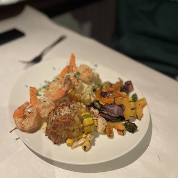 Rusty Scupper - a plate of food on a table - Seafood Near Me - Baltimore, Maryland Rusty Scupper - a plate of food on a table - Seafood Near Me - Baltimore, Maryland