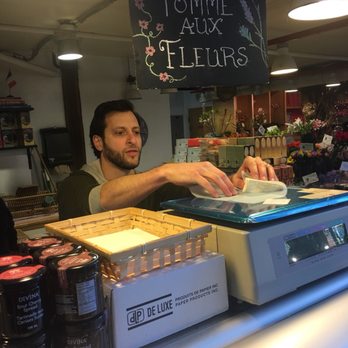 Benton Brothers Fine Cheese - a man working behind a counter - Cheese Shops Near Me - Vancouver, British Columbia Benton Brothers Fine Cheese - a man working behind a counter - Cheese Shops Near Me - Vancouver, British Columbia