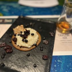 Lures Bar And Grille - 4th course ... sweet cream rice pudding, molasses tuile cookie, dried fruit (blk berry & cranberry), and hazelnut brittle