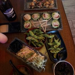 Pork Gyoza, Miso Soup, Chili Garlic Edamame, Lollipop Roll, and In and Out Roll. Pork Gyoza, Miso Soup, Chili Garlic Edamame, Lollipop Roll, and In and Out Roll.