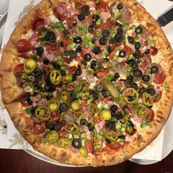 Larco Bros. Pizzeria - Customized Large Meatlovers with garlic crust - Pizza Near Me - Auburn Hills, Michigan