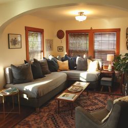 Wood Street Guest House - The living room in our 2 bedroom "main house." Both of our rentals have these custom sleeper-sofas with real mattresses!