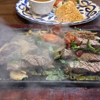 Juanita’s Mexican Kitchen - Beef Fajitas, still sizzling - Mexican Near Me - Cypress, Texas Juanita’s Mexican Kitchen - Beef Fajitas, still sizzling - Mexican Near Me - Cypress, Texas