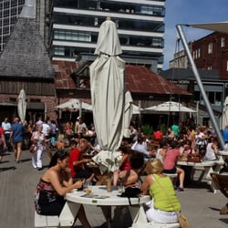 The Oast House - Large patio with swarms of people enjoying a sunny summer's day in Manchester. Live band was a nice touch.