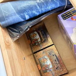Sorcery booster boxes and play mats