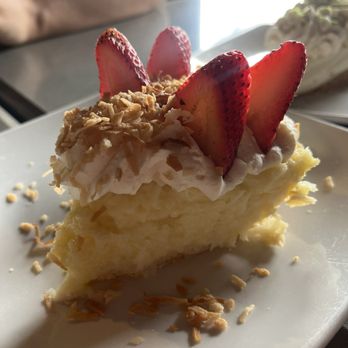 Anthonie's Market Grill - Coconut creme pie (idk about these strawberries, so oddly placed) - Seafood Near Me - Simonton, Texas