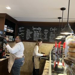 Buzz Coffee And Tea - Experienced barista to the left and trainee - bagels