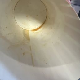 Grease in bottom of cheese curd container