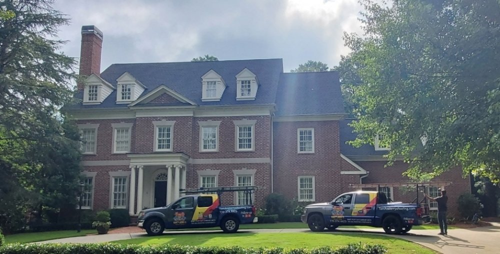 Slide of Tom and Jerry's Roofing