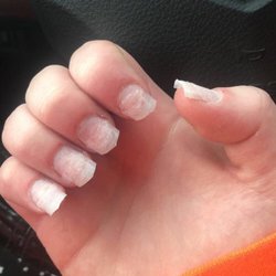 Magic Nails - After she spoke up and said she was leaving , she made her stay and tried to charge her for tip removal . Then threw change at her