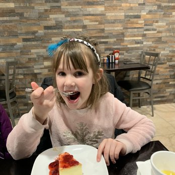 The Crossings Restaurant - My daughter eating the cheesecake. - Breakfast & Brunch Near Me - Pendleton, Indiana