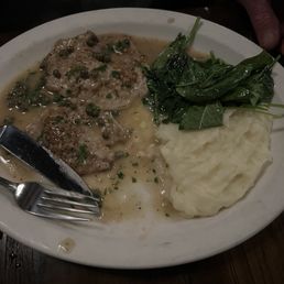 Veal in a lemon caper sauce with mashed potatoes and spinach Veal in a lemon caper sauce with mashed potatoes and spinach