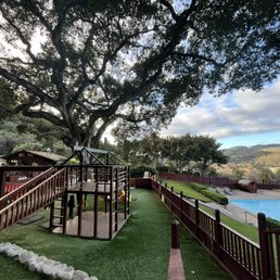 Park overlooking the pool, sauna and mountains.