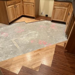 Allstars Hardwood Flooring - Concrete slab, previous vinyl flooring, current vinyl flooring.