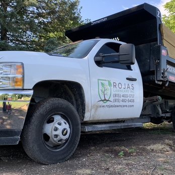 Rojas Lawncare - a dump truck parked in a wooded area - Landscaping Near Me - Harvard, Illinois Rojas Lawncare - a dump truck parked in a wooded area - Landscaping Near Me - Harvard, Illinois
