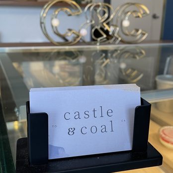 Castle & Coal - a sign on a glass table - Coffee & Tea Near Me - Toronto, Ontario Castle & Coal - a sign on a glass table - Coffee & Tea Near Me - Toronto, Ontario
