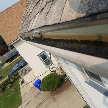 Carlino's Roofing - the gutter lifted to its correct position - Roofing Near Me