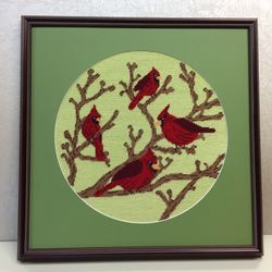 Frameworks - Needlepoint with round opening cut in the mat.