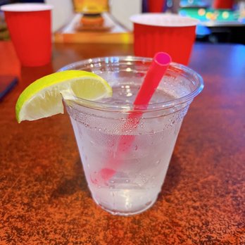 The Goose Pub N Eatery - a drink with a slice of lemon - Pubs Near Me - Bellevue, Washington