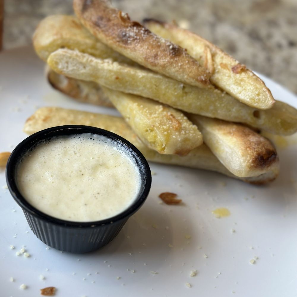 Theo's Italian - Breadsticks with Alfredo sauce - Italian Near Me - Plainfield, Indiana Theo's Italian - Breadsticks with Alfredo sauce - Italian Near Me - Plainfield, Indiana