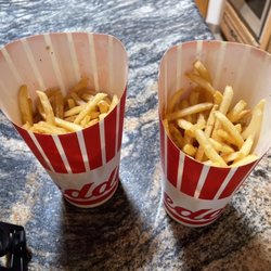 These two photos show 2 supposed Large orders of French Fries. Rip.