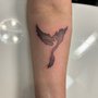 Photo of Sacred Tattoo