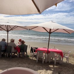 El Cato - Eat under the huge tiki hut or at tables with your toes in the sand