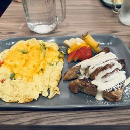 Cranberry walnut cheesecake French toast, half portion with scrambled eggs with veggies. Cranberry walnut cheesecake French toast, half portion with scrambled eggs with veggies.