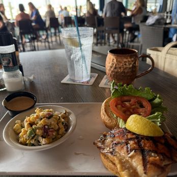 Dockside Waterfront Grill - Grouper sandwich and corn salad with the sweet chile sauce instead of tartar with a Moscow mule to drink - Seafood Near Me - Venice, Florida