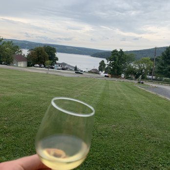 Agricolae Estate Winery - a hand holding a glass of wine - Wine Tasting Room Near Me - Hammondsport, New York Agricolae Estate Winery - a hand holding a glass of wine - Wine Tasting Room Near Me - Hammondsport, New York