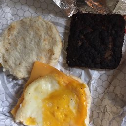 Breakfast sausage, egg and cheese on a hot buttered biscuit.