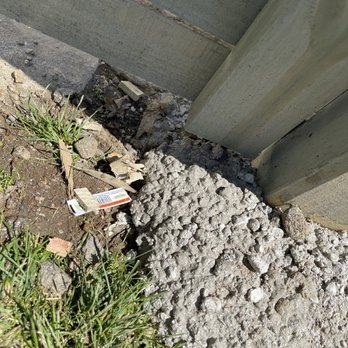 Fence & Gate Solutions - More unevenly poured cement with trash and wood chips - Fences & Gates Near Me - The Bronx, New York Fence & Gate Solutions - More unevenly poured cement with trash and wood chips - Fences & Gates Near Me - The Bronx, New York