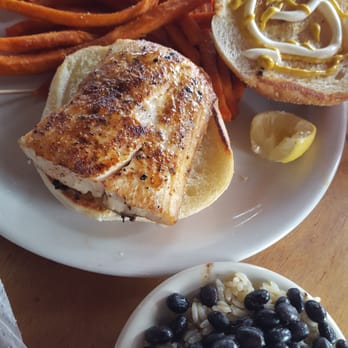 Hurricane Patty's - Lightly blackened mahi sandwich with sweet potato fries and rice /blk beans - American Near Me - St. Augustine, Florida Hurricane Patty's - Lightly blackened mahi sandwich with sweet potato fries and rice /blk beans - American Near Me - St. Augustine, Florida