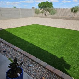 a backyard with artificial grass