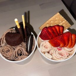 two bowls of ice cream and strawberries two bowls of ice cream and strawberries