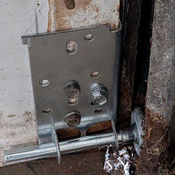 EK Garage Door - Bottom roller with cable attachment replaced on our old wooden overhead door. - Garage Door Services Near Me - Tinley Park, Illinois EK Garage Door - Bottom roller with cable attachment replaced on our old wooden overhead door. - Garage Door Services Near Me - Tinley Park, Illinois