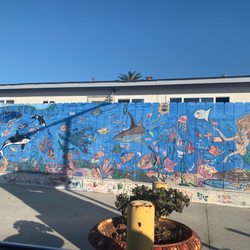 Mural on fence in lot