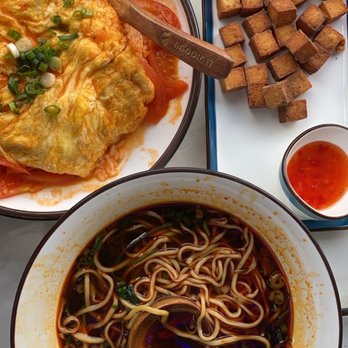 Noodle St - Egg & tomatoes over rice, braised beef noodle soup, and crispy tofu. - Noodles Near Me - Pasadena, California Noodle St - Egg & tomatoes over rice, braised beef noodle soup, and crispy tofu. - Noodles Near Me - Pasadena, California