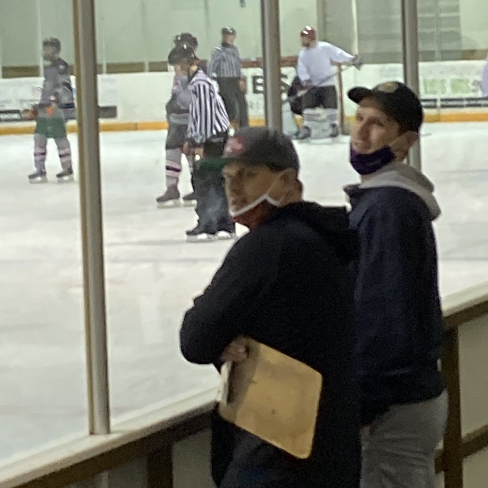 Two coaches of youth hockey. Don't know how to wear masks. Shameful.