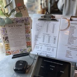 a menu, tablet, and phone a menu, tablet, and phone