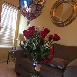 Dozen 'o Roses with creative White rose in the middle--one always stands out! Well done!!