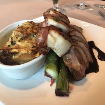 The Brickyard - Duck with pancetta wrapped scallops added and potatoes au gratin - Steakhouses Near Me - Boise, Idaho The Brickyard - Duck with pancetta wrapped scallops added and potatoes au gratin - Steakhouses Near Me - Boise, Idaho