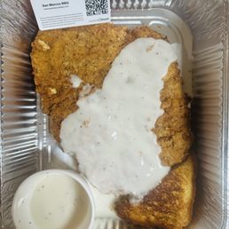 This is JP's Wimberley BBQ's Chicken Fried Pork Chop. I added their loyalty card in the upper left just for scale. This is JP's Wimberley BBQ's Chicken Fried Pork Chop. I added their loyalty card in the upper left just for scale.
