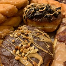 a variety of different flavored donuts a variety of different flavored donuts