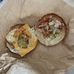 Supposed to be a Little Mac, but it's a regular cheeseburger WITHOUT THE PATTY... Supposed to be a Little Mac, but it's a regular cheeseburger WITHOUT THE PATTY...